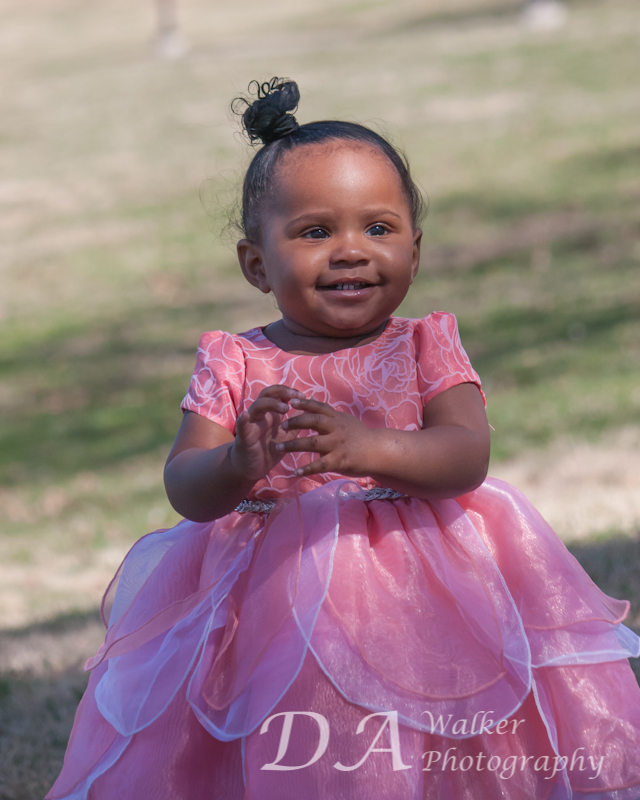  Small girl in a pink dress.