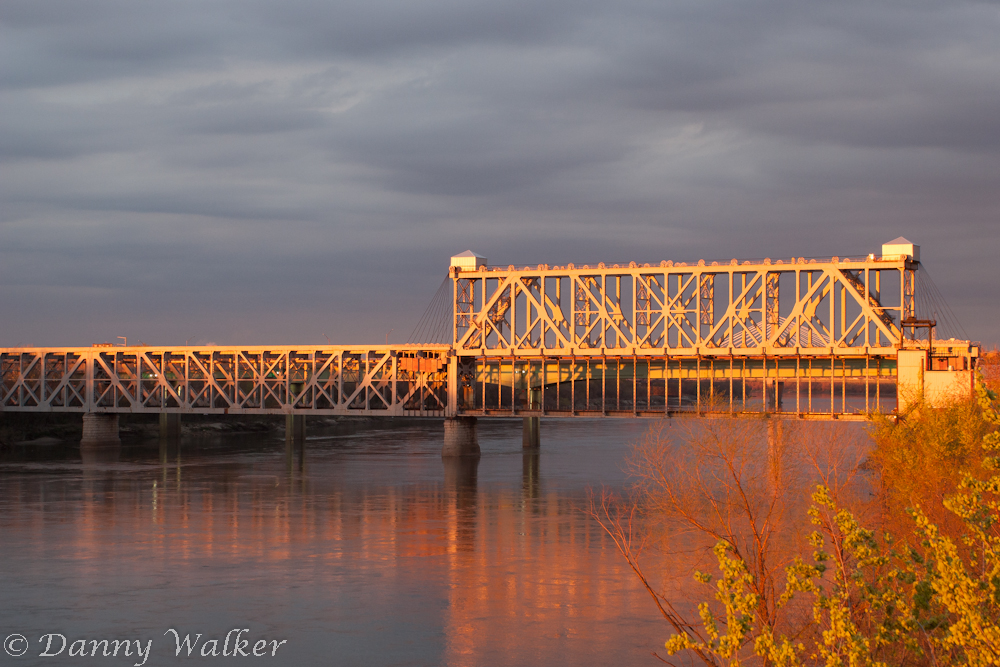 Old metal bridge warmly iluminated by a sunset.